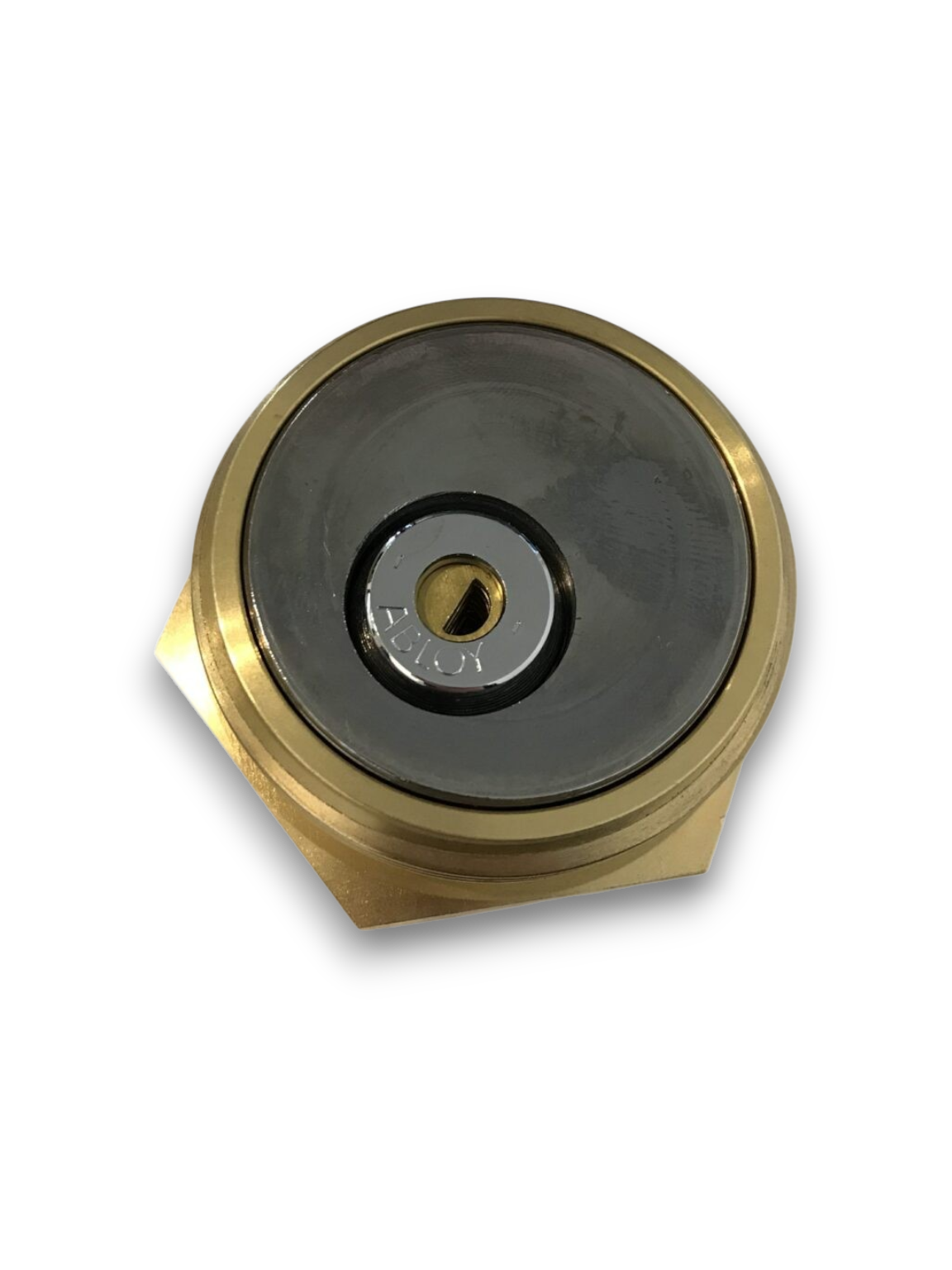 En cirkulär mekanism av mässing och metall för ett LÅSBART TANKLOCK DIESELTANKAR med ett nyckelhål i mitten, sedd uppifrån mot en enfärgad vit bakgrund.