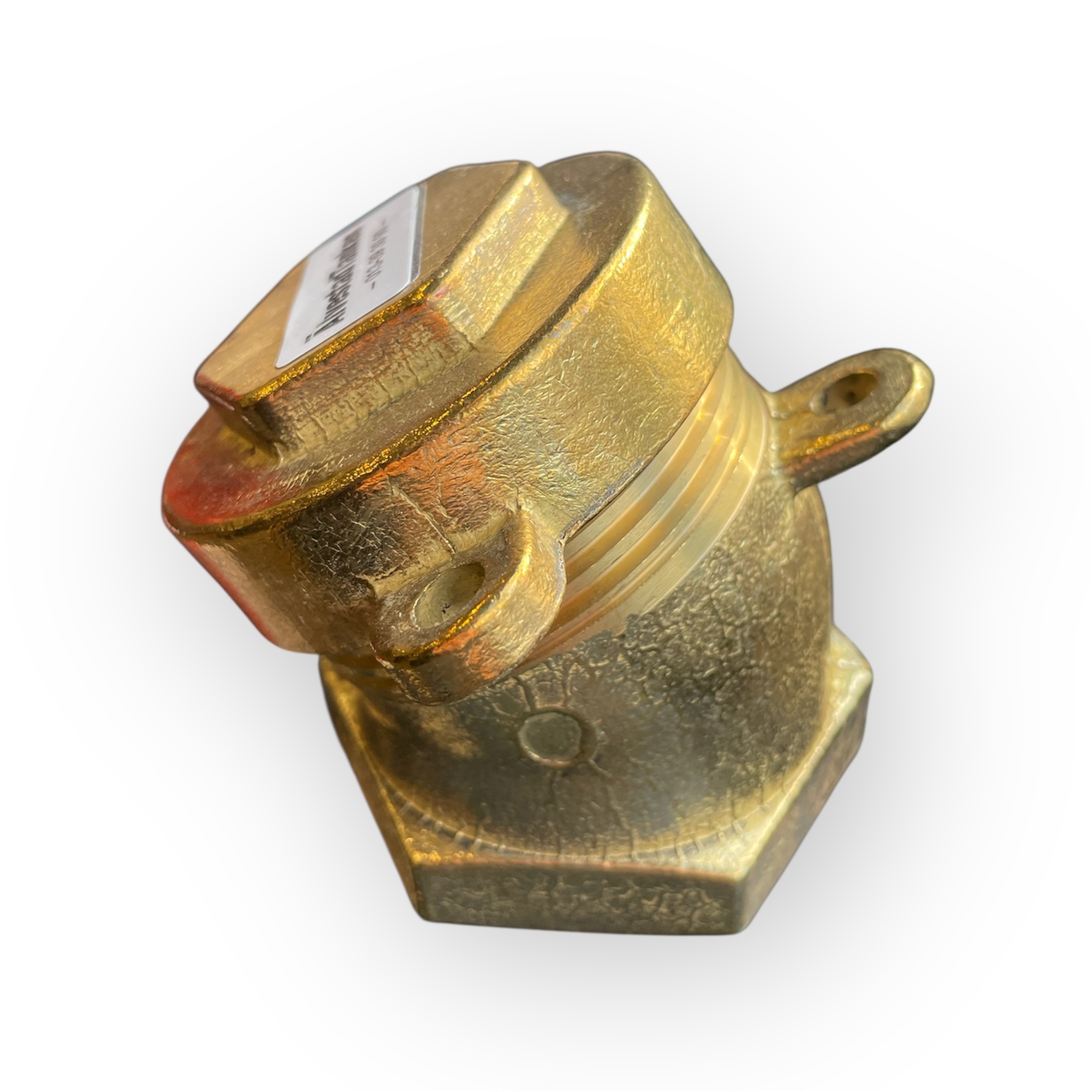 TANKLOCK 2 TUM MÄSSING 30° är en mekanisk komponent i mässing med sexkantig bas, gängad mittdel, topp med etikett, metallisk yta och en utskjutande ögla på ena sidan.